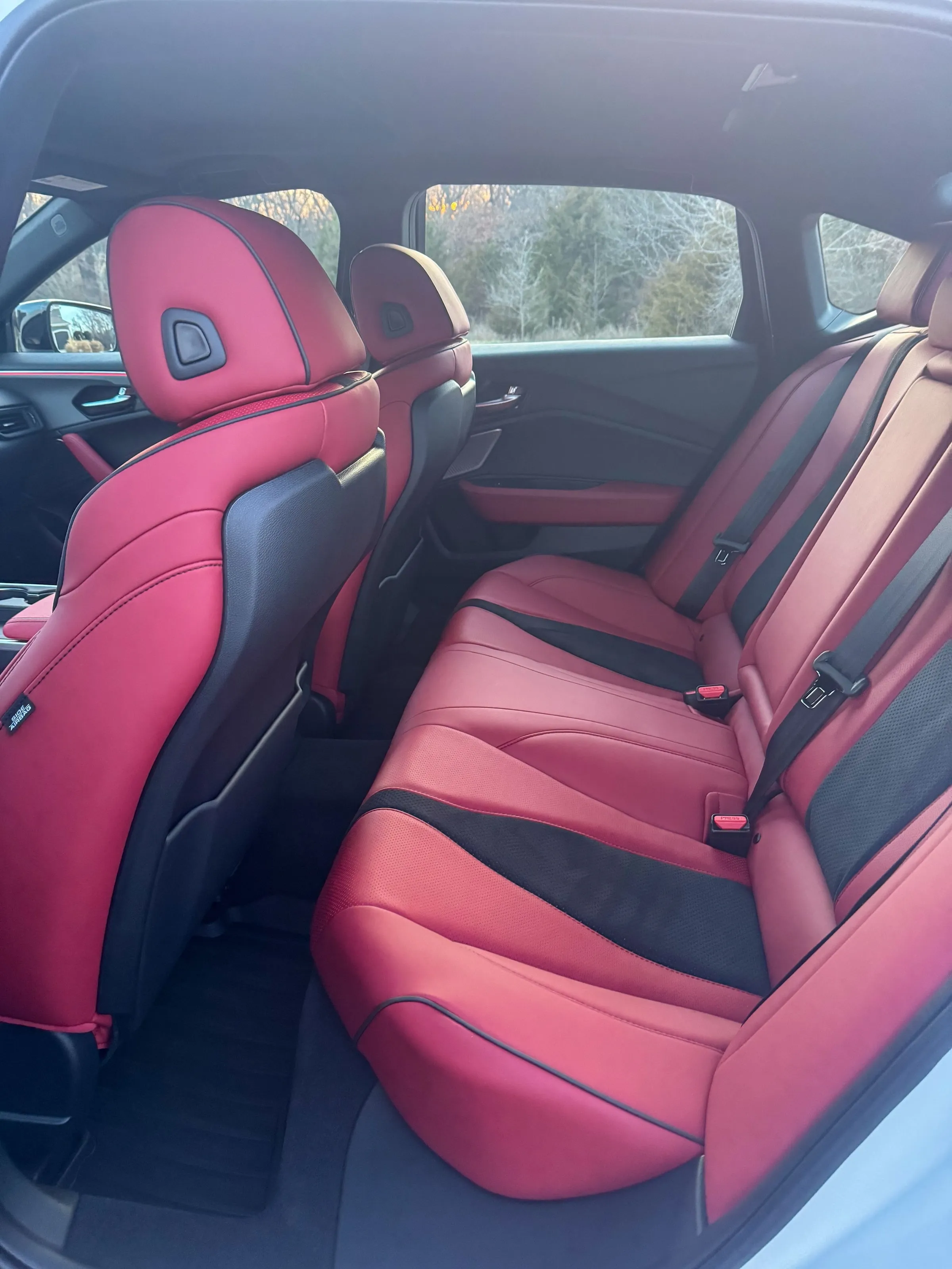 Rear bench of an Acura TLX Type S in red leather, seats and carpet cleaned