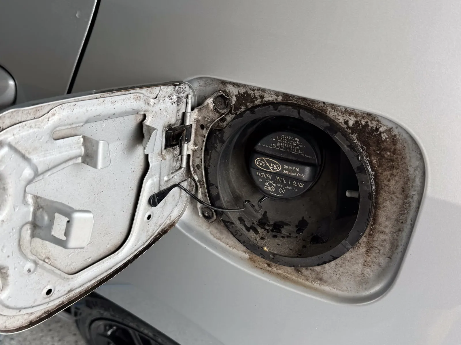 Before, Fuel filler surround, baked-on grime to clean