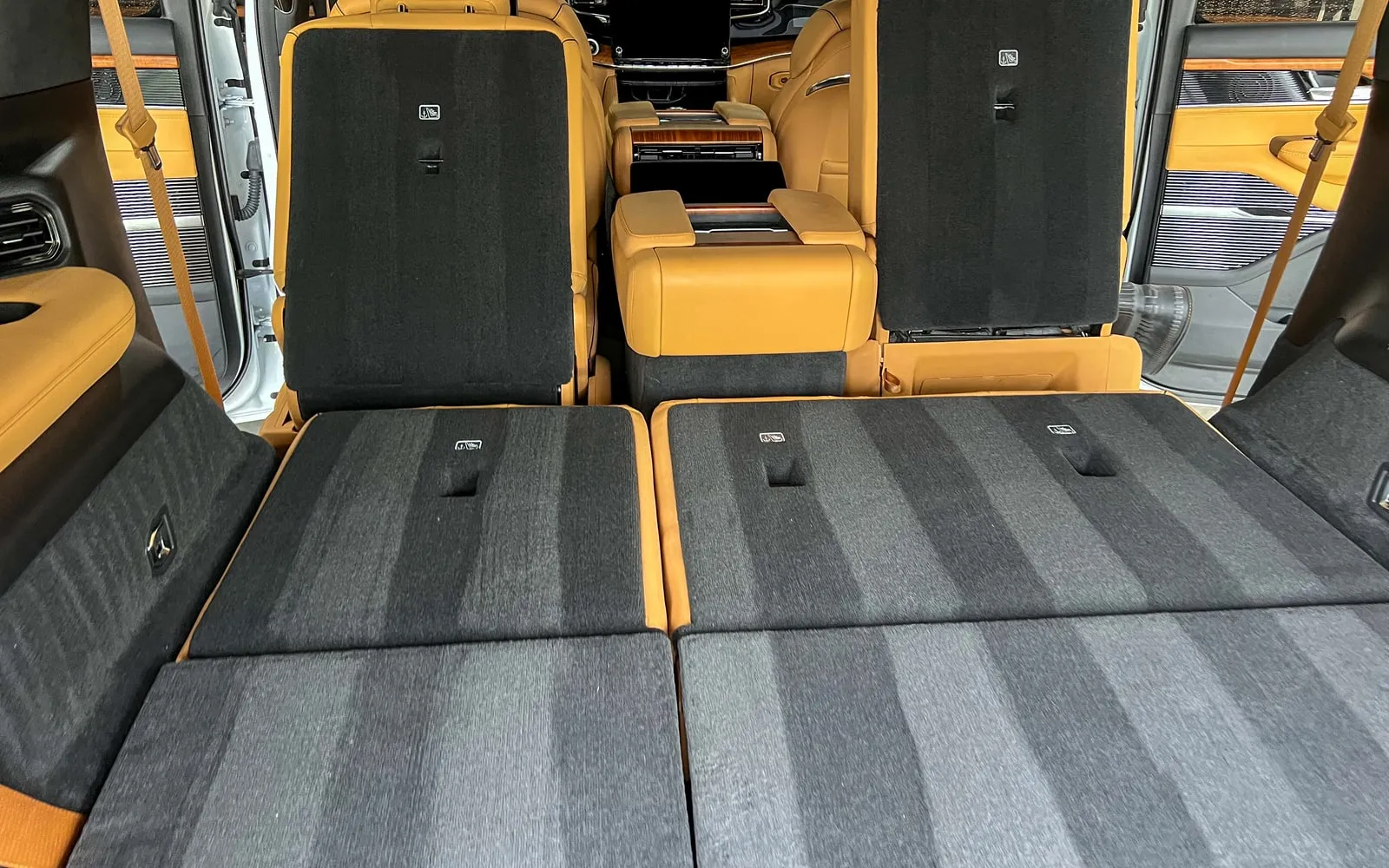A clean, detailed SUV cargo area with the third-row seats folded flat
